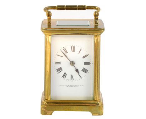 An early 20thC brass cased carriage clock, the square white enamel dial bearing Roman numerals, Goldsmiths and Silversmiths C