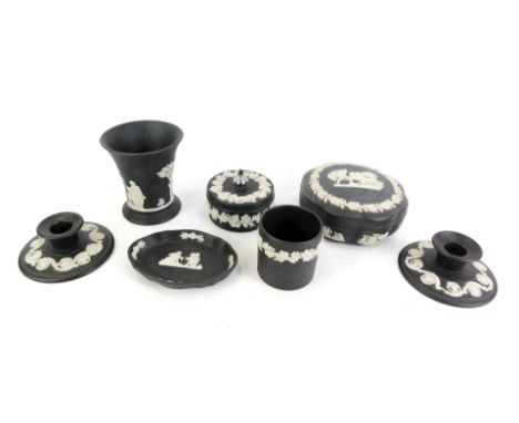 A collection of Wedgwood black Jasperware, comprising two squat candle stands, trinket dish, octagonal stylised trinket dish 