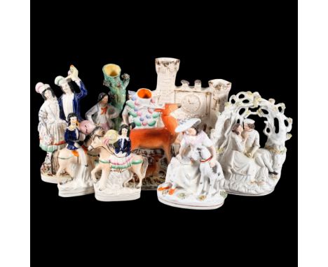 A group of Staffordshire ceramic figures, including various figures on horseback, spill vases, etc (4), and other Staffordshi