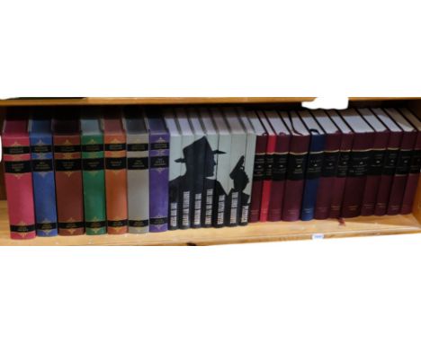 A shelf of folio and other books, including Jane Austen, Anthony Trollope, HG Wells, etc