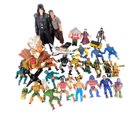 A box of various play-worn toy action figures, including Masters of the Universe, Teenage Mutant Ninja Turtles, Action Man, e