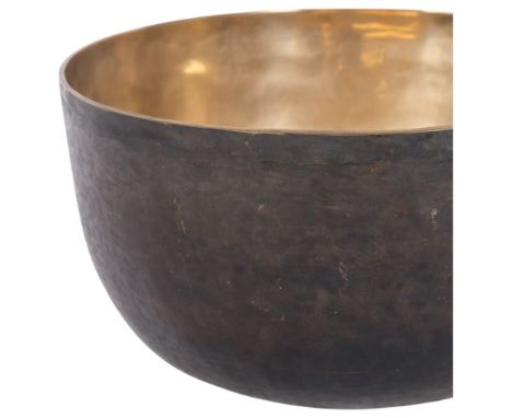 A large Tibetan hammered bronze singing bowl, diameter 25cm, height 12.5cm