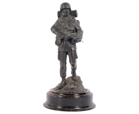 A Ballantynes of Walkerburn Ltd Scottish Borders, a resin bronze figure, a Royal Artillery Infantryman, on turned wood stand,