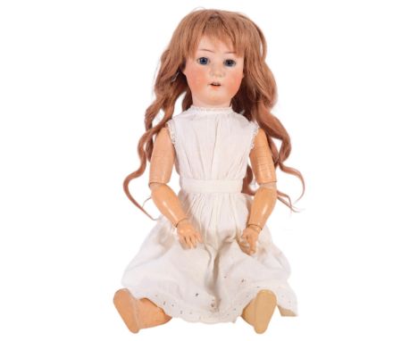 A porcelain-headed Heubach Koppelsdorf porcelain-headed doll, no. 251-4, with jointed composition limbs, 57cm