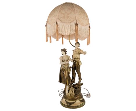 A large Continental painted metal table lamp, supported by 2 country figures, with shade, H92cm overall, stamped LE Moreau