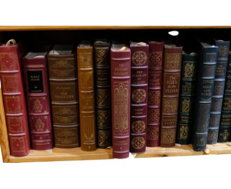 A shelf of folio and other books, including Dickens, Dante, Defoe, etc