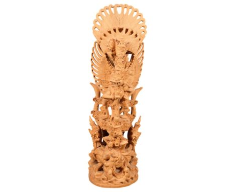 A highly detailed Balinese carved wood figural group sculpture of Vishnu and Garuda, 45cm