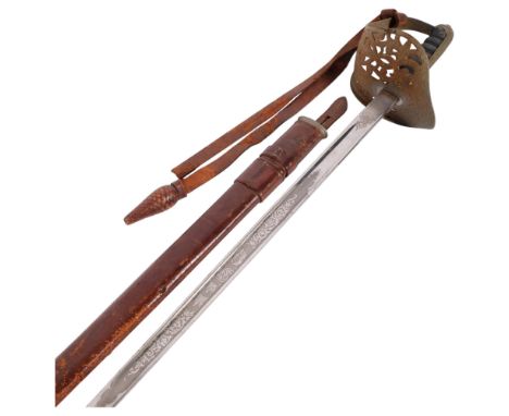 A 1897 pattern Infantry Officer's sword with leather scabbard, having an engraved blade marked GR, and Church Lads Brigade Al