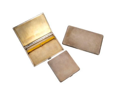 3 silver engine turned cigarette cases, largest 14cm x 8.5cm, 17oz total (3)