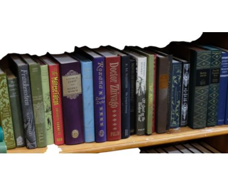A shelf of folio and other books, including Dickens, George Eliot, Chekhov, etc