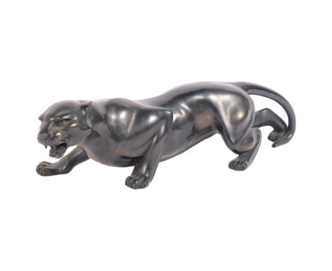 A patinated resin bronze study of a jaguar, L53cm