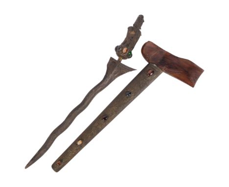 An Indonesian Kris ceremonial sword, and scabbard, the Kris having a deity brass figural handle with cabochon stone set band,