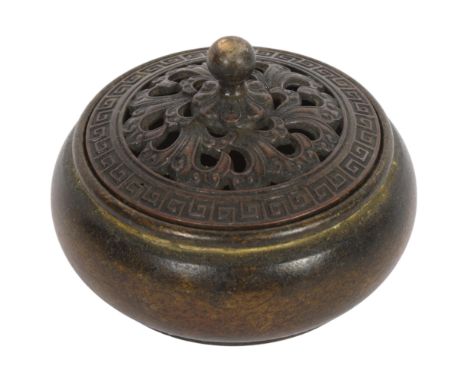 A Chinese patinated bronze incense burner and cover, 9cm