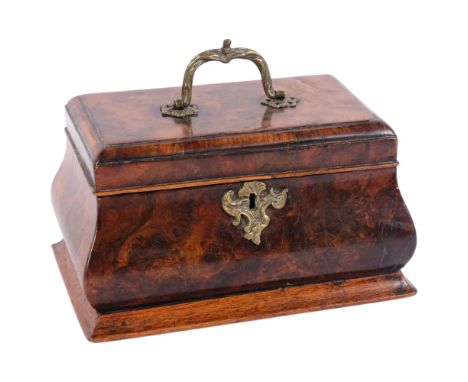 A Georgian walnut caddy, with 3-sectional interior, ogee shaped form with brass swing handle, W24cm