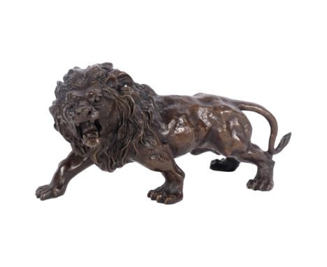 A bronze study of a prowling lion, L32cm