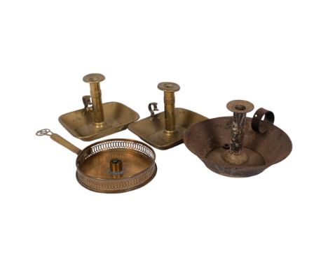 A pair of brass ejector chamber sticks, a steel ejector chamber stick, and a brass chamber stick (4)