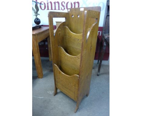 An Arts and Crafts Glasgow School inlaid oak newspaper stand 