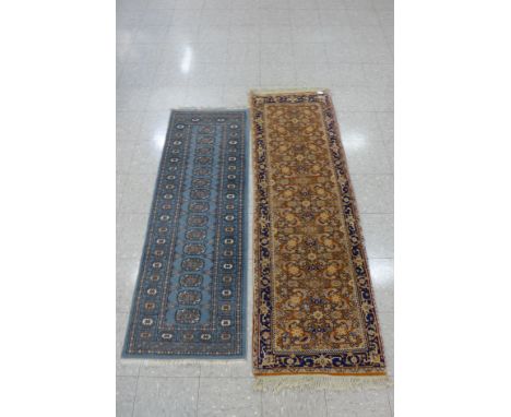 A small blue ground rug and a runner 