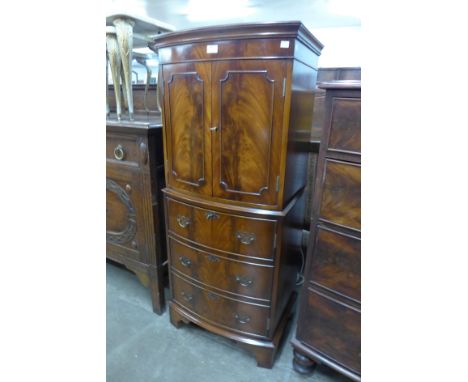 A mahogany bow front cocktail cabinet 