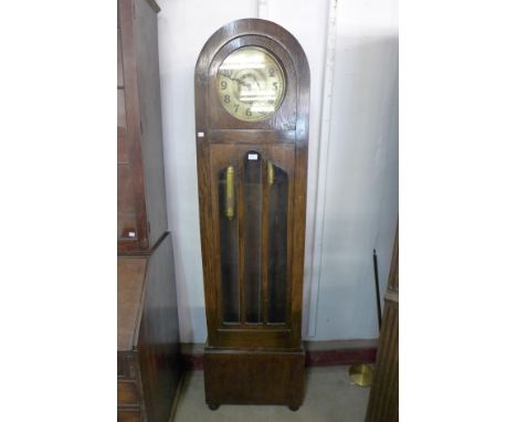 An early 20th Century oak triple weight longcase clock 