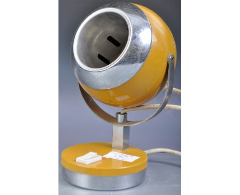 An original retro vintage 1960's Italian designer Eyeball / Eye Ball shape work desk lamp in a mustard yellow enamel finish w
