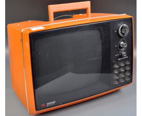 An original retro vintage 1970's Hitachi P-32-311 Portable Television in a vibrant orange colourway complete with hoop aerial