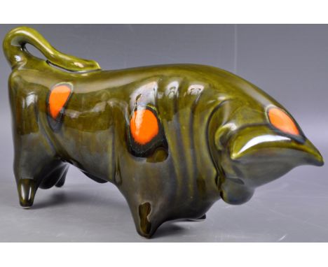 Colin Melbourne - Trentham Pottery - an original retro vintage mid 20th Century ceramic bull of stylised form in green glaze,