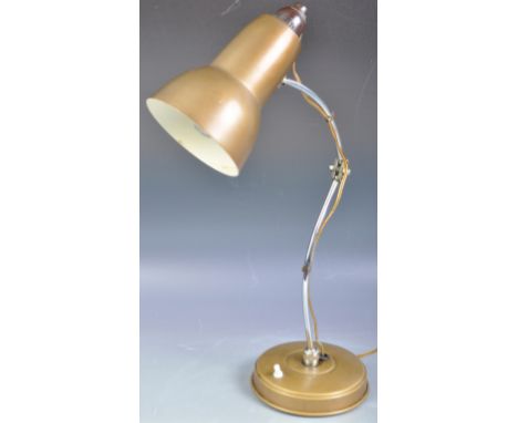 An original retro vintage mid 20th Century c1950s French style desk / work lamp. Gold coloured metal circular base, raised on