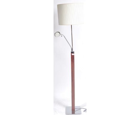 A contemporary 20th Century floor standing standard lamp having a pleated shade with chrome lamp raised on wooden square colu