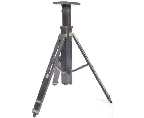 An antique early 20th Century ebonised adjustable camera / light tripod having and adjustable plinth top connection to the ce