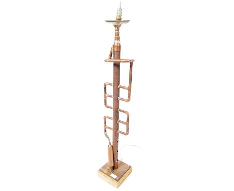 An unusual vintage 20th Century industrial copper and metal pipe lamp light having a central rustic metal column stem with a 
