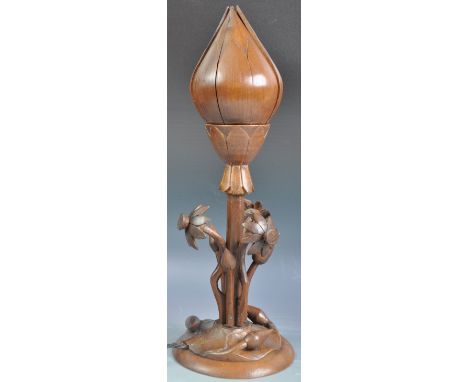 A retro mid 20th Century carved hardwood and mahogany metamorphic desk / table lamp. The top in the form of a lotus flower, w