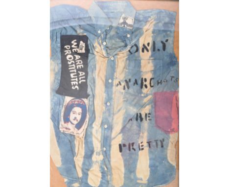 A retro vintage 20th Century Controversial Punk shirt having various Sex Pistols iconography including God Save The Queen, On
