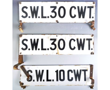 A collection of six vintage early 20th Century industrial enamel Safe Working Load hundredweight signs having a white ground 
