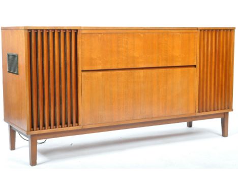 An original retro vintage 1960's teak wood radiogram sideboard credenza having a drop down front with twin speaker grille fro