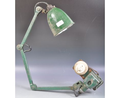 An original retro vintage mid 20th Century 1950's English industrial factory work desk lamp light having a green enamel penda