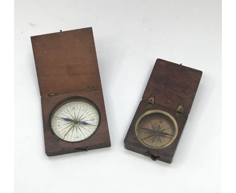 A 19th century wooden cased compass, with pivoting latch, small pin stop button to the inside of the case, approximately 7cm 