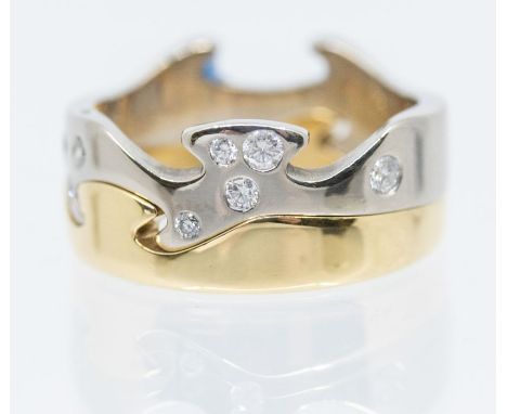 Georg Jensen- a pair of 18ct gold  'Fusion' rings comprising a white gold diamond set ring, flush set to the front with varyi