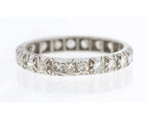 A diamond set platinum eternity ring, comprising round cut diamonds each approx 2mm, total diamond weight approx 0.65ct, size