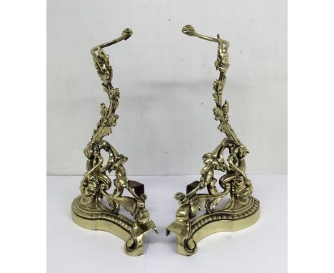 A pair of cast brass andirons, made in the neo-classical style.With acanthus leaf, tendril, flower and scroll decoration.Iron