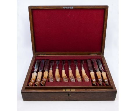 Equestrian Interest: A set of twelve early 20th Century novelty knives and forks, the ceramic knife handles modelled as a hor