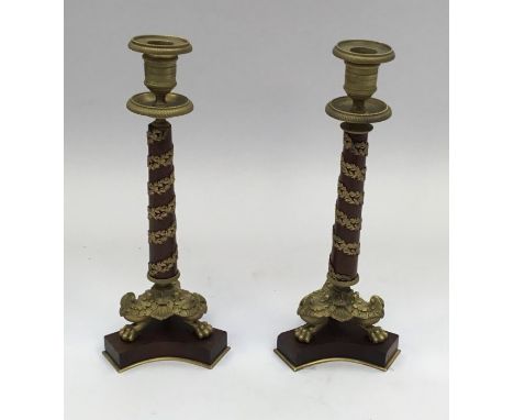 19th century pair of French Ormolu candlesticks.Tripod lion’s paw base, with central wooden column, the latter with applied a