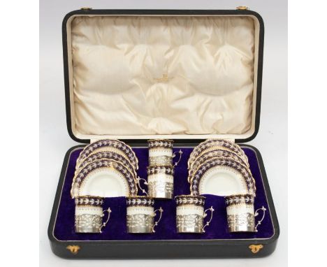 A set of six George VI silver mounted Aynsley china coffee cans with matching saucers, pattern no: A3529, the silver cup hold