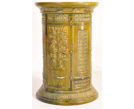 A large 20th century Wedgwood green majolica ceramic plant stand / jardiniere of circular form having a repeating foliate mot