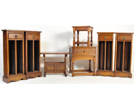 A set of Old Charm by Wood Bros oak pedestal Cd racks. Each raised on plinth bases with upright bodies having inset cd racks 