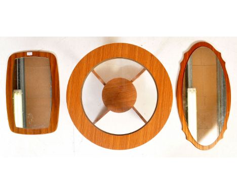 Two retro vintage 20th century teak veneer mirror both having floating mirror glass. Together with a circular glass coffee ta