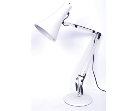 A 20th century Herbert Terry manner anglepoise desk lamp in white colourway. The lamp having a circular vase with sprung adju