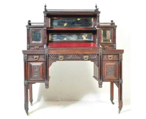 A 19th century late Victorian Chinese Chippendale revival dickens desk. The desk on castors with column detailed legs, carved