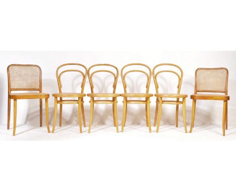 A harlequin set of six retro vintage mid 20th century bentwood dining chairs having hooped backs with case seats raised on up