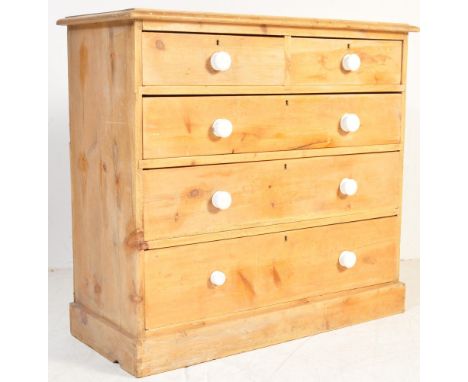 A Victorian 19th century country pine chest of drawers. Raised on a plinth base with 2 short over 3 deep drawers having white